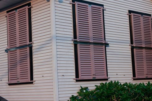 Colonial shutters need additional bars to stay closed during the storm.